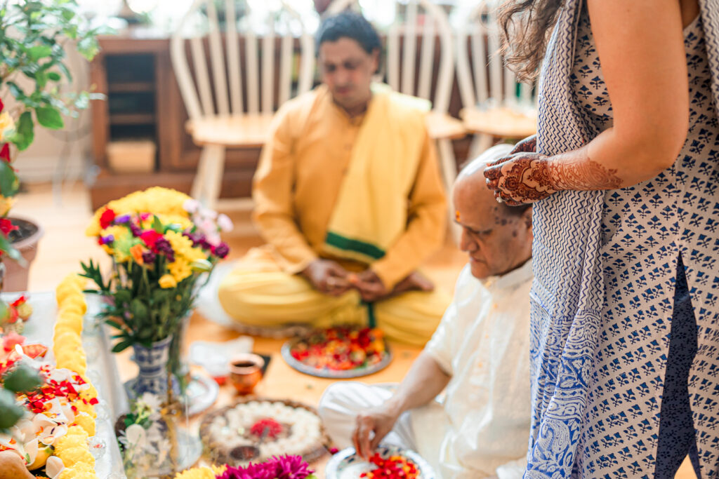 An Indian couple partake in the Haldi before their wedding day.