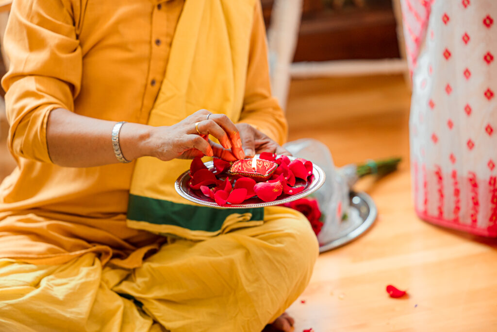 An Indian couple partake in the Haldi before their wedding day.