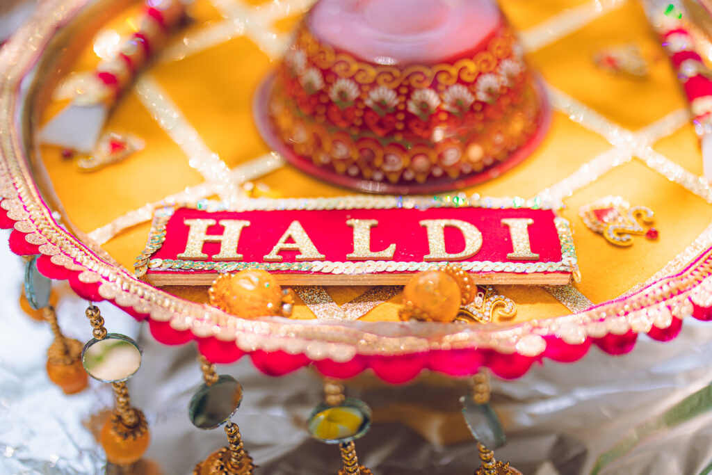 An Indian couple partake in the Haldi before their wedding day.