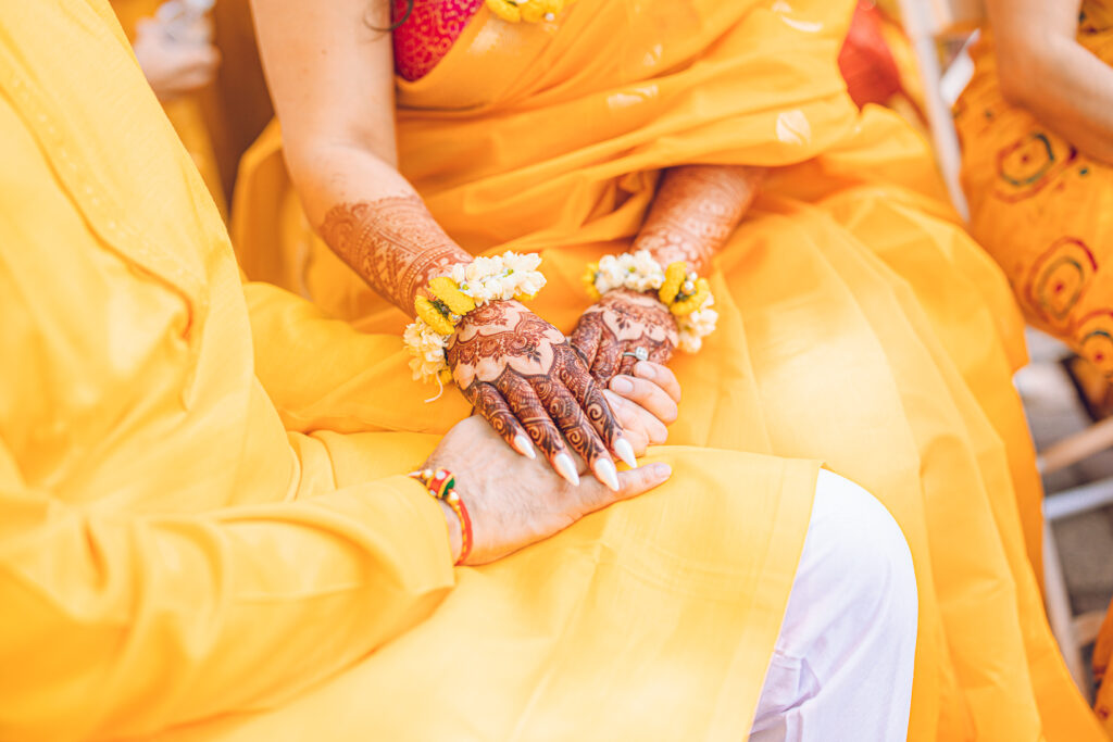 An Indian couple partake in the Haldi before their wedding day.