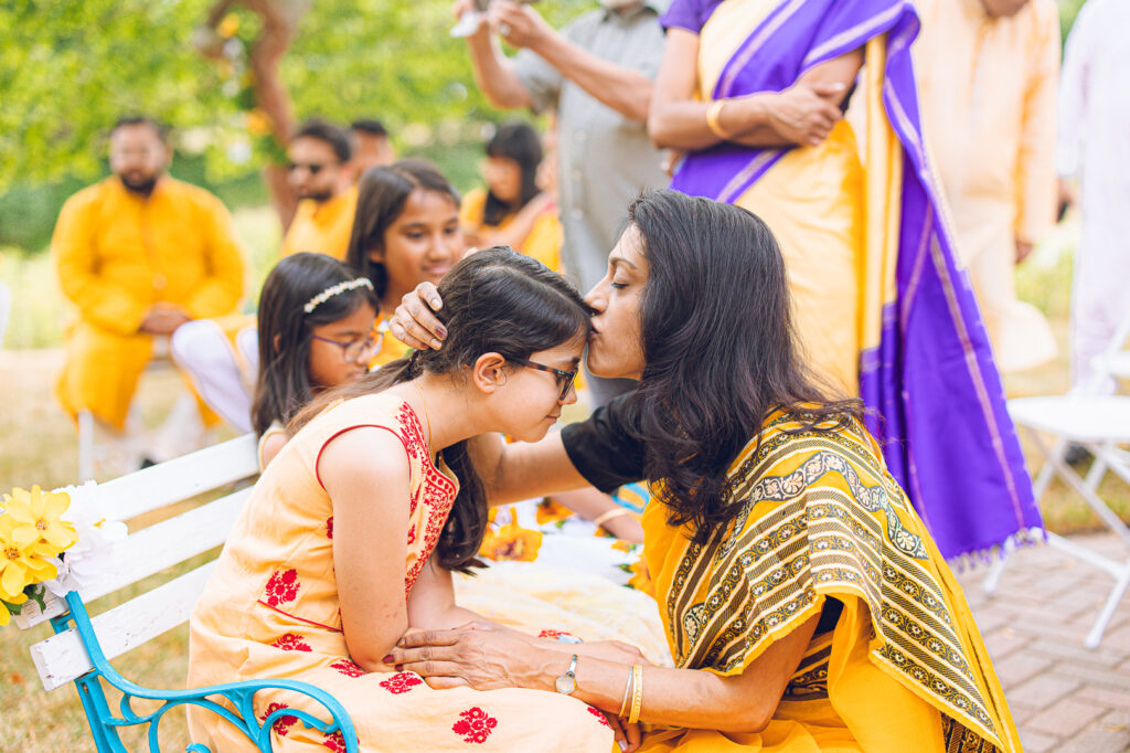 An Indian couple partake in the Haldi before their wedding day.