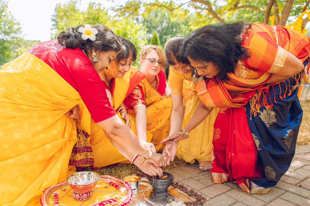 An Indian couple partake in the Haldi before their wedding day.