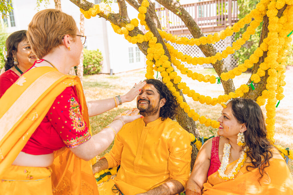An Indian couple partake in the Haldi before their wedding day.