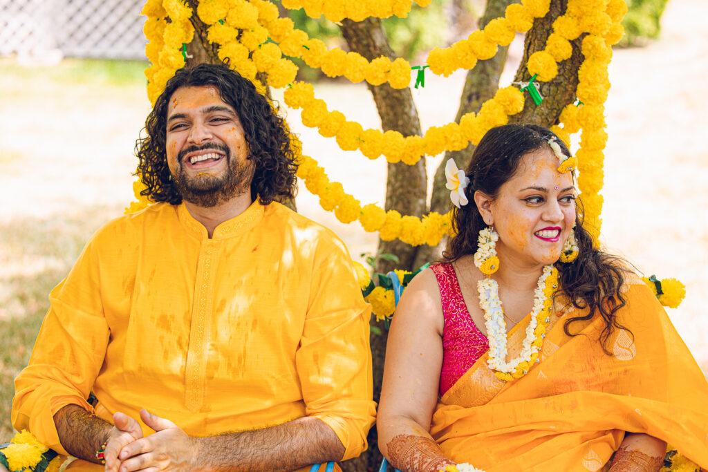 An Indian couple partake in the Haldi before their wedding day.