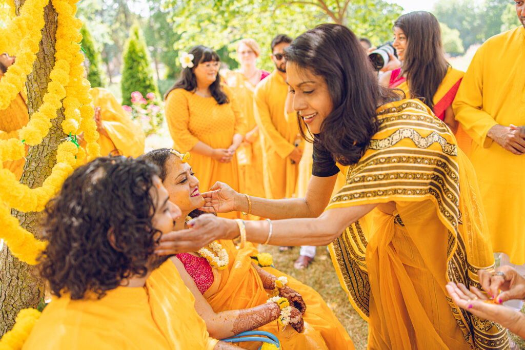 An Indian couple partake in the Haldi before their wedding day.