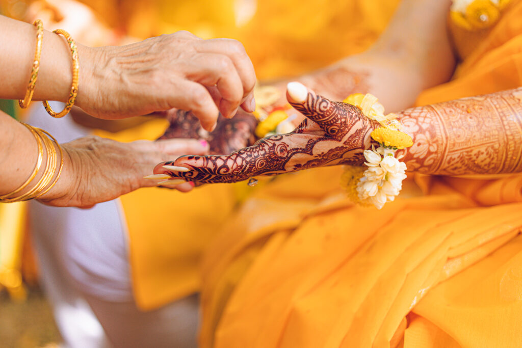 An Indian couple partake in the Haldi before their wedding day.