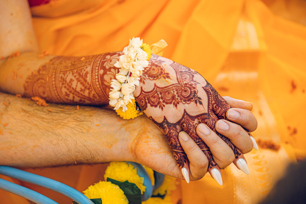 An Indian couple partake in the Haldi before their wedding day.
