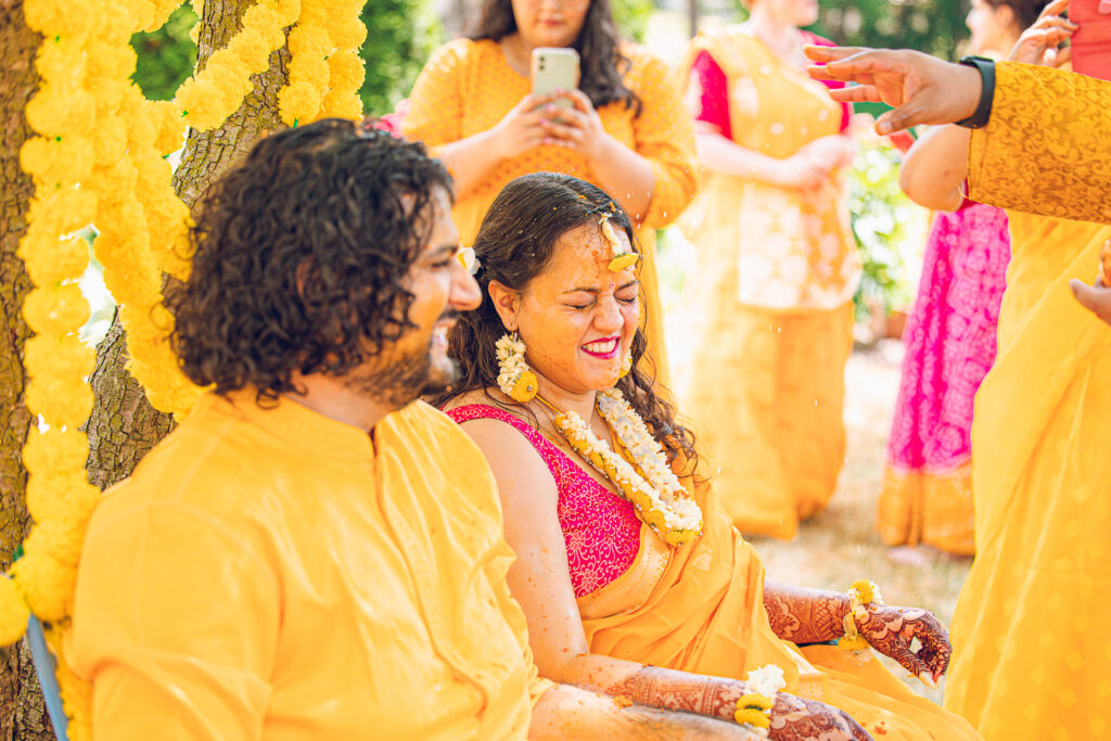 An Indian couple partake in the Haldi before their wedding day.