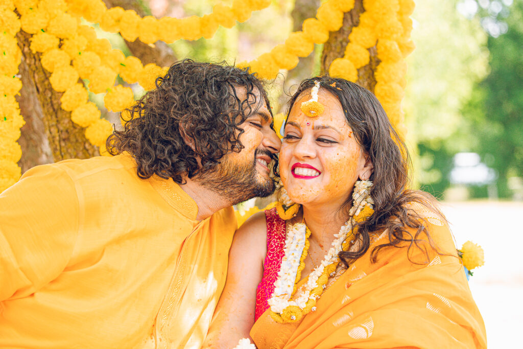 An Indian couple partake in the Haldi before their wedding day.