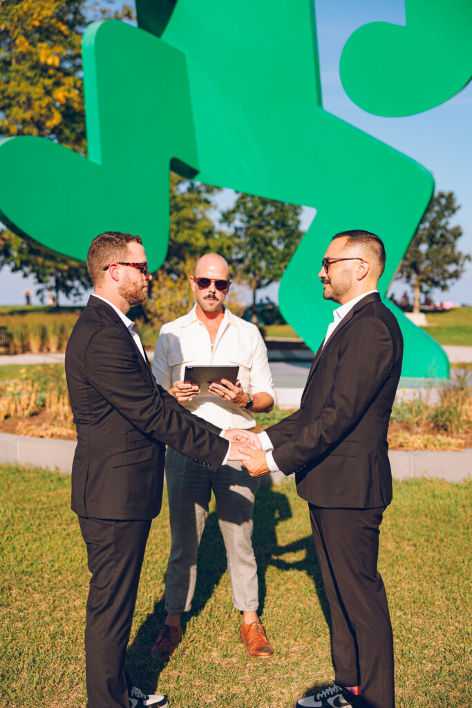 A gay couple exchanges vows at the AIDS Memorial Garden in Chicago.