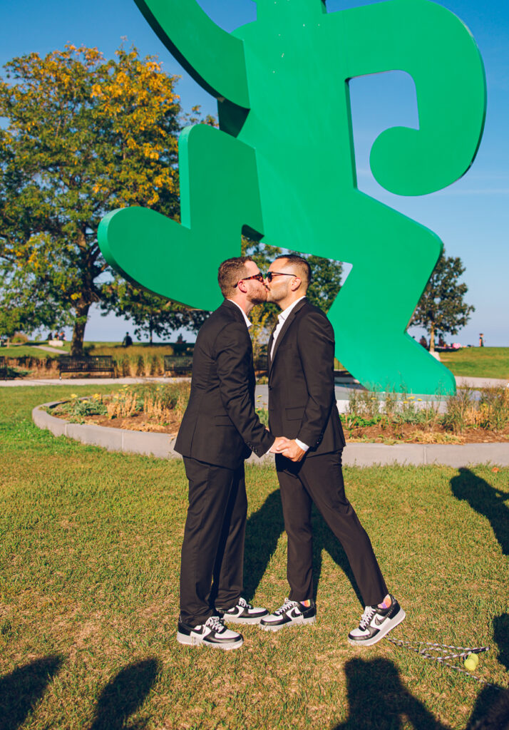 A gay couple exchanges vows at the AIDS Memorial Garden in Chicago.