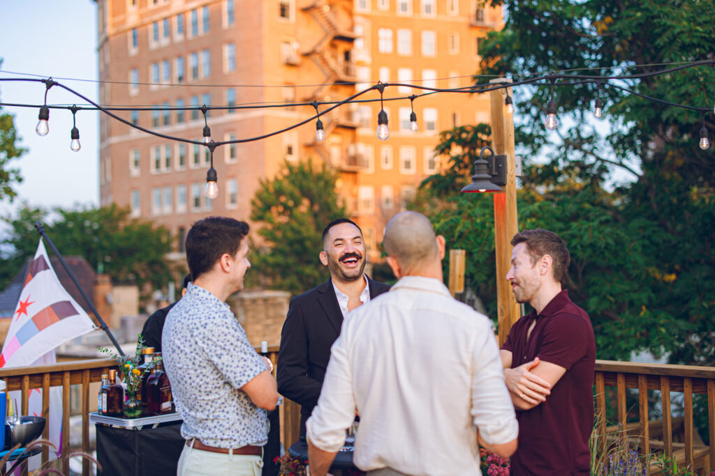 A gay couple celebrates their wedding day at home with a DIY reception on their rooftop in Lakeview, Chicago.