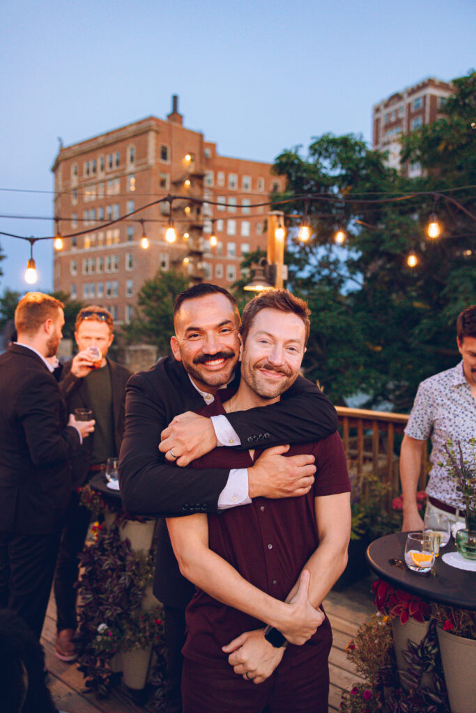 A gay couple celebrates their wedding day at home with a DIY reception on their rooftop in Lakeview, Chicago.