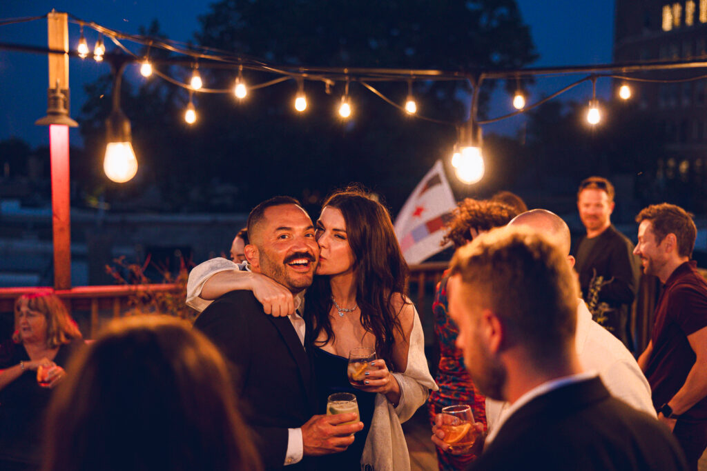 A gay couple celebrates their wedding day at home with a DIY reception on their rooftop in Lakeview, Chicago.