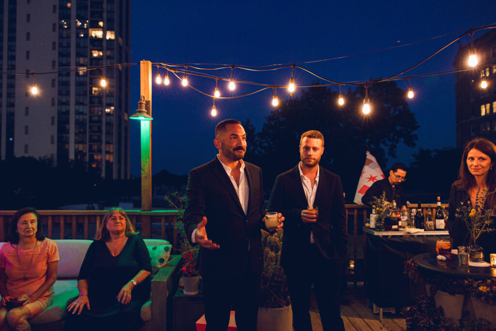 A gay couple celebrates their wedding day at home with a DIY reception on their rooftop in Lakeview, Chicago.