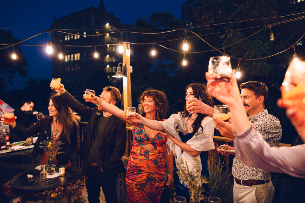 A gay couple celebrates their wedding day at home with a DIY reception on their rooftop in Lakeview, Chicago.