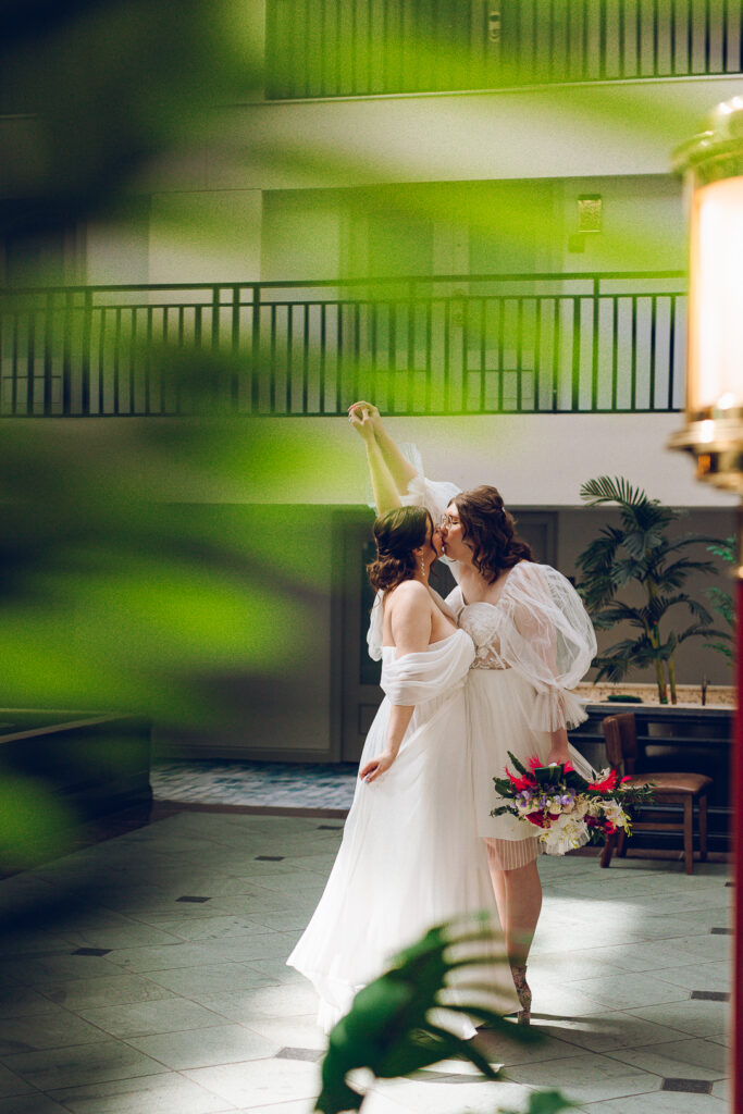 A queer couple gets ready before their wedding at the Doubletree Hotel in Downer's Grove, Illinois.