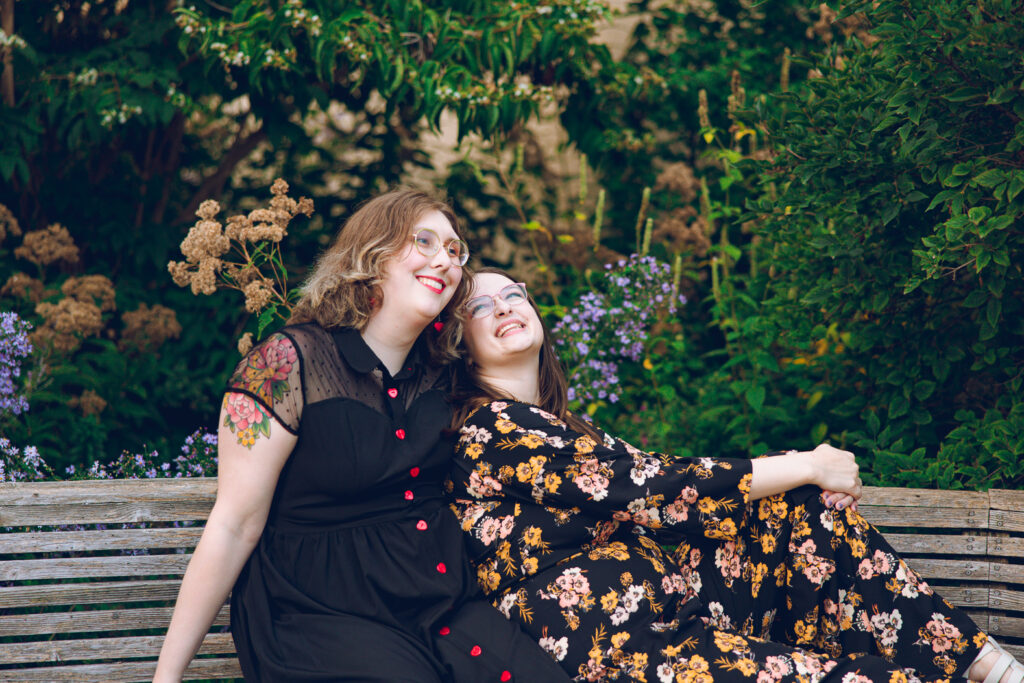 A queer couple poses for their engagement session at the North Pond in Lincoln Park, Chicago.