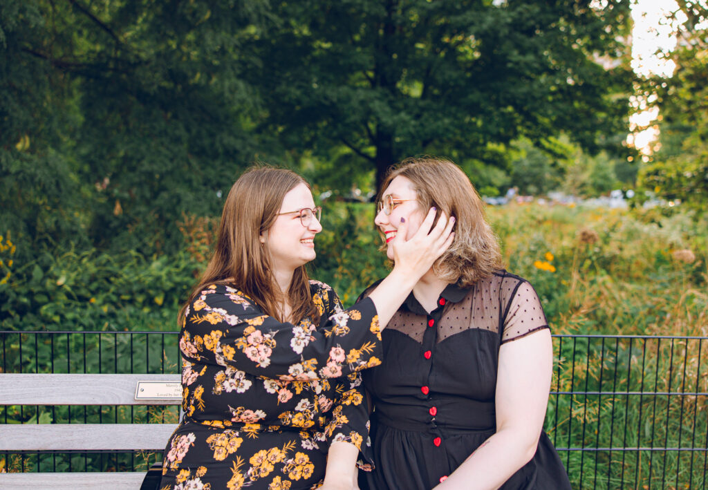 A queer couple poses for their engagement session at the North Pond in Lincoln Park, Chicago.