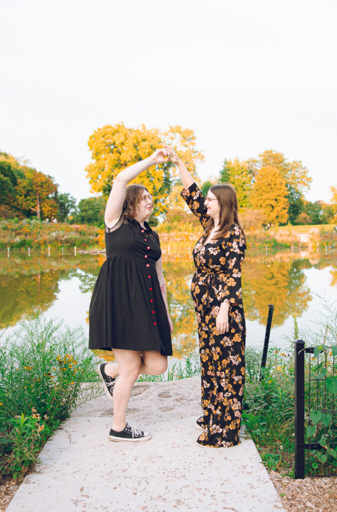 A queer couple poses for their engagement session at the North Pond in Lincoln Park, Chicago.