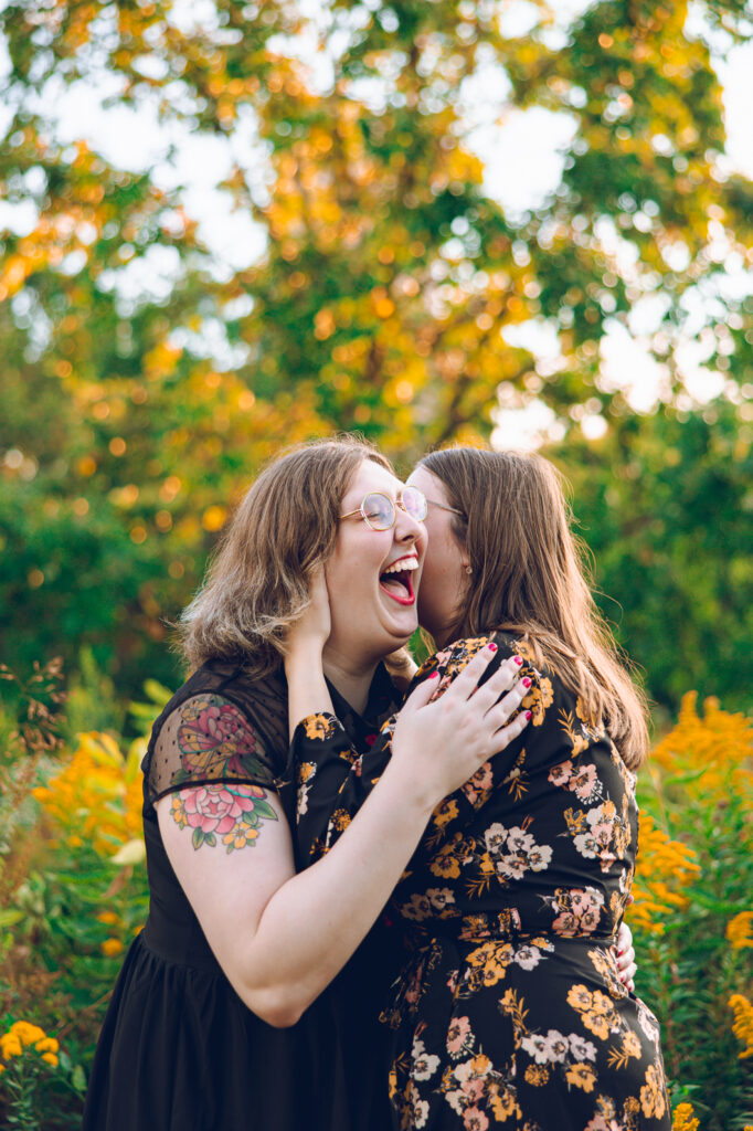 A queer couple poses for their engagement session at the North Pond in Lincoln Park, Chicago.