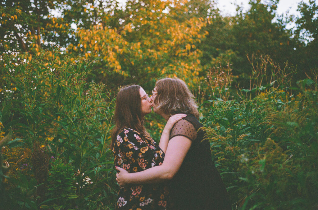 A queer couple poses for their engagement session at the North Pond in Lincoln Park, Chicago.