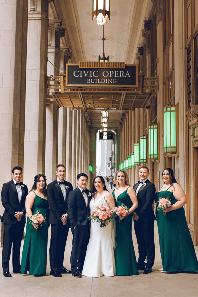 A wedding party under the Civic Opera Building in Chicago