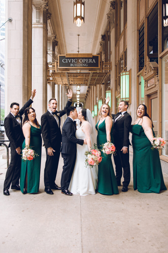 A wedding party under the Civic Opera Building in Chicago