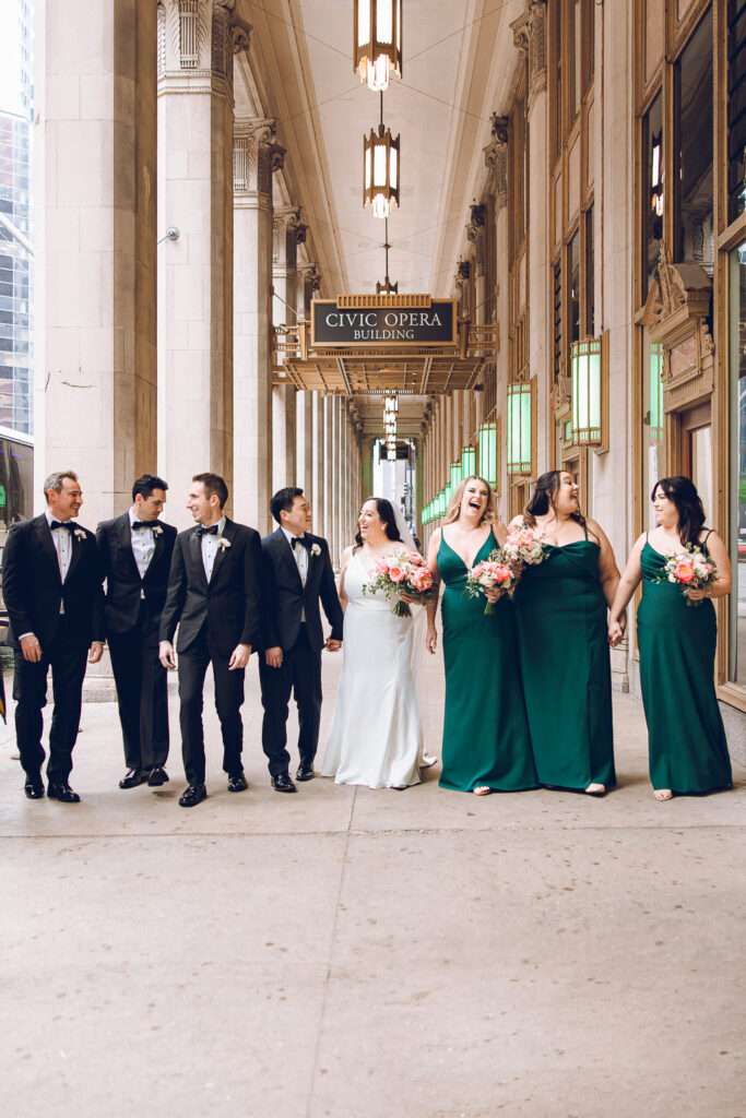 A wedding party under the Civic Opera Building in Chicago