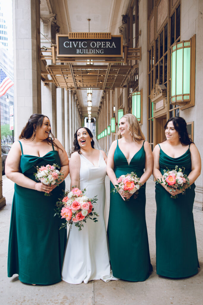 A wedding party under the Civic Opera Building in Chicago