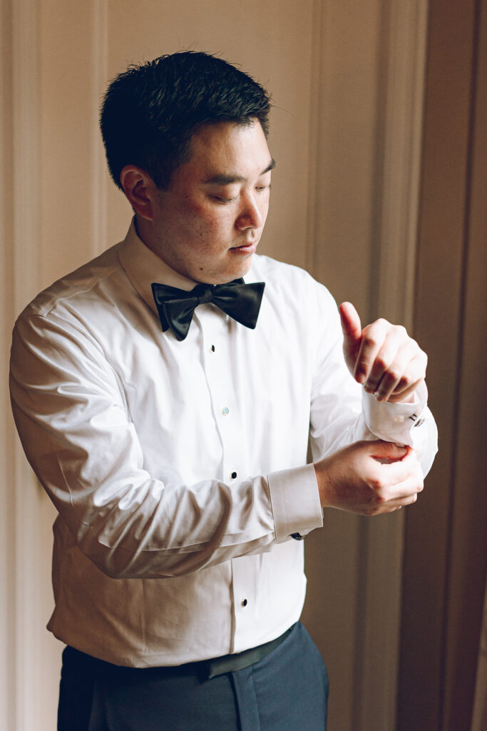 A couple getting ready at the Palmer House Hotel in the Loop in Chicago