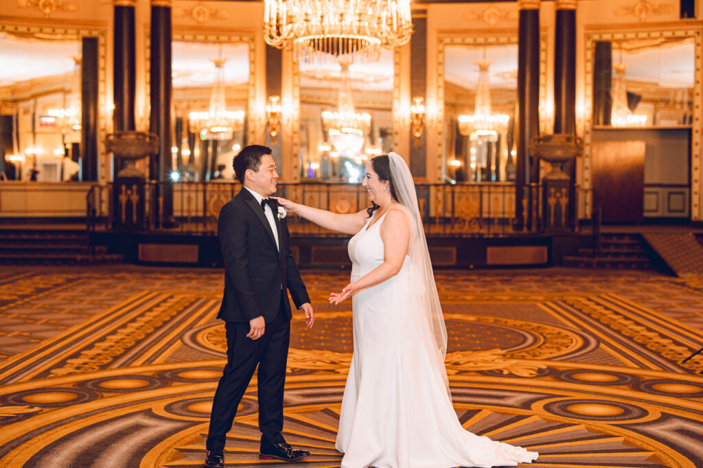 A couple getting ready at the Palmer House Hotel in the Loop in Chicago