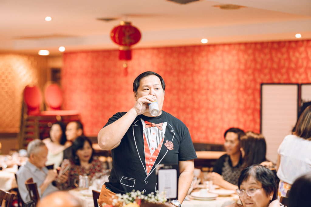 A couple hosts a traditional Chinese wedding reception at Lee Wing Wah in Chinatown, Chicago.