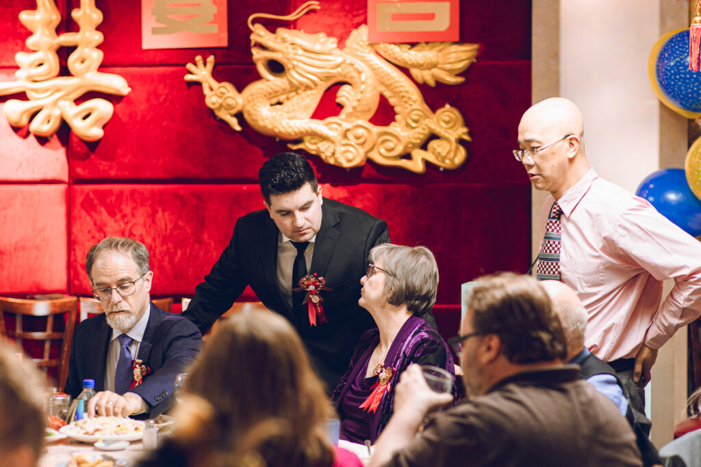 A couple hosts a traditional Chinese wedding reception at Lee Wing Wah in Chinatown, Chicago.