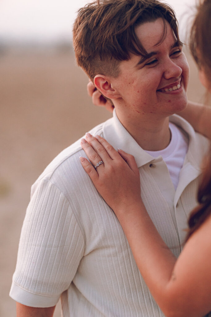 A queer proposal on Montrose Beach at sunset