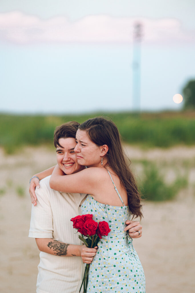 A queer proposal on Montrose Beach at sunset