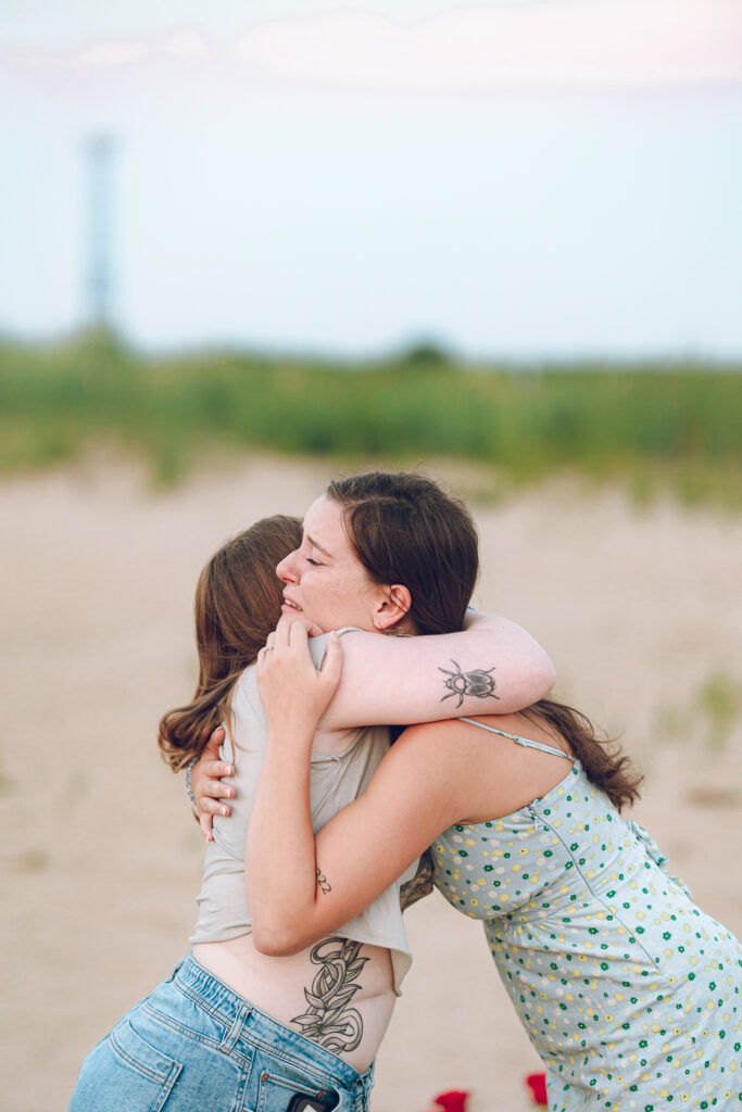 A queer proposal on Montrose Beach at sunset