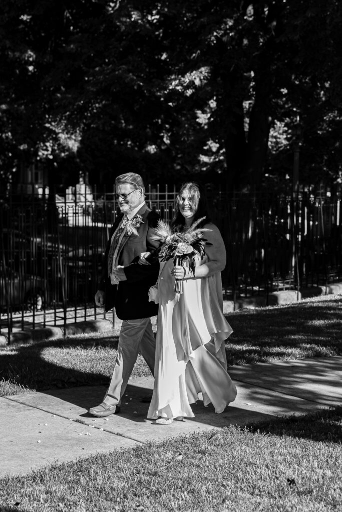 A couple gets celebrates their wedding at Pleasant House in Oak Park, Illinois.