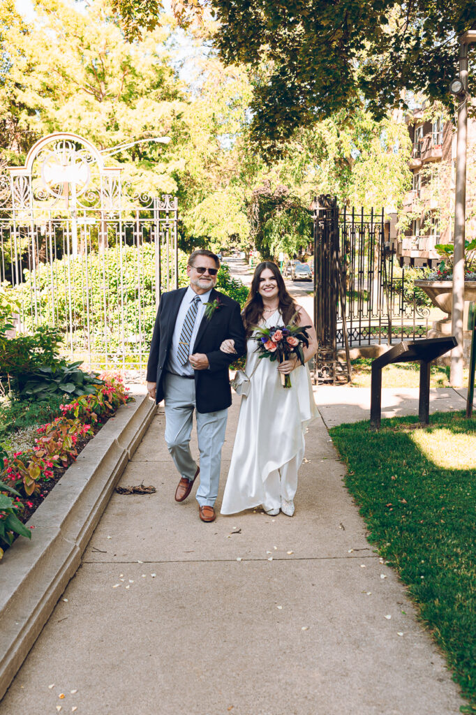A couple gets celebrates their wedding at Pleasant House in Oak Park, Illinois.