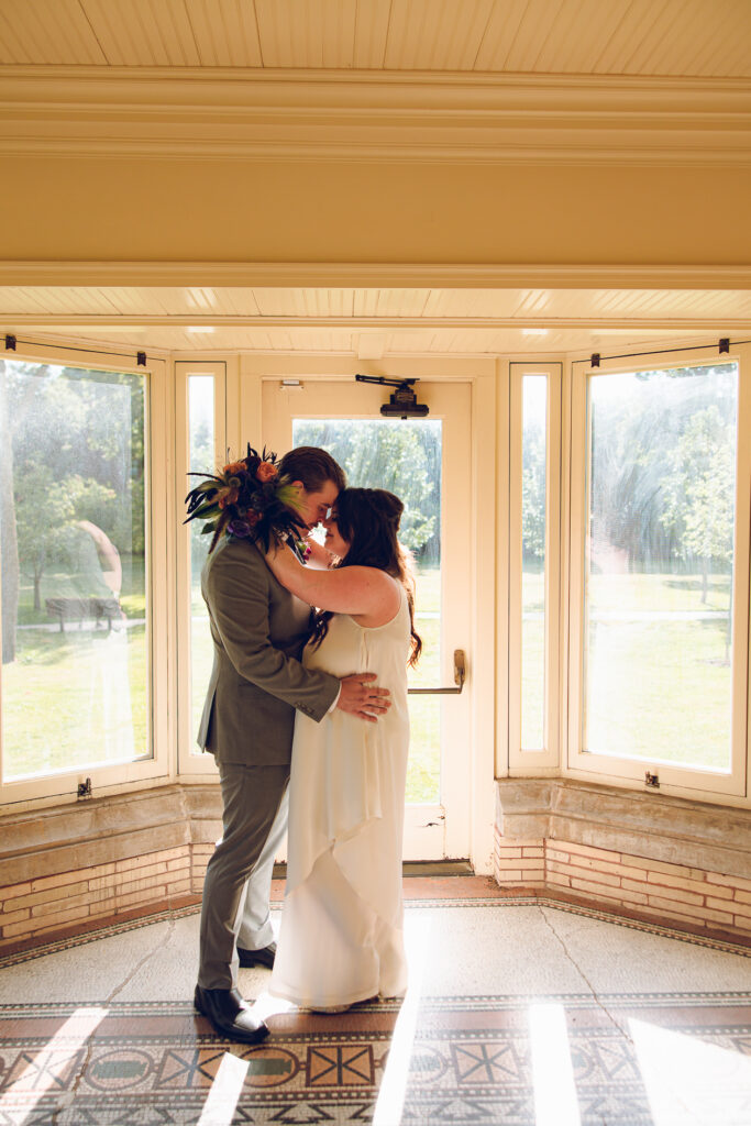 A couple gets celebrates their wedding at Pleasant House in Oak Park, Illinois.