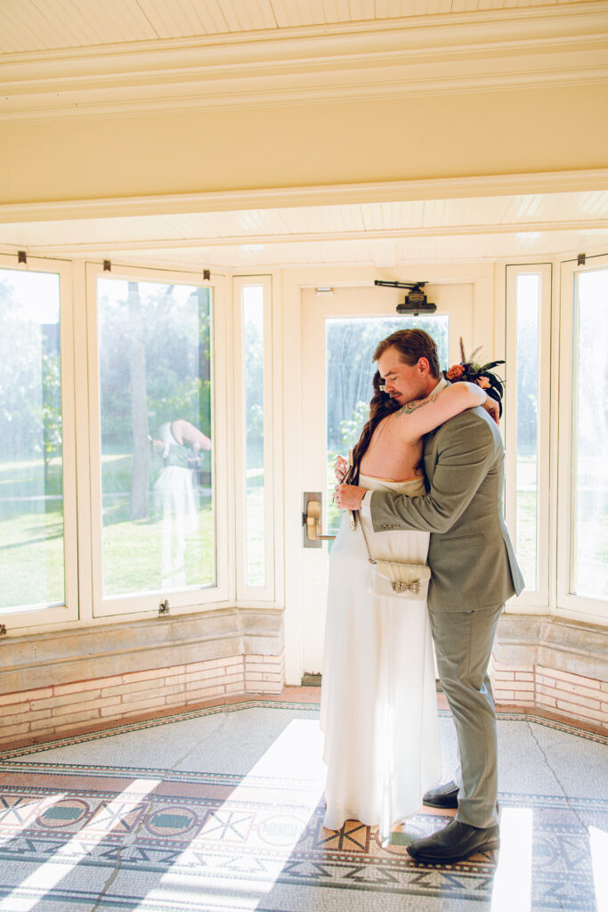 A couple gets celebrates their wedding at Pleasant House in Oak Park, Illinois.