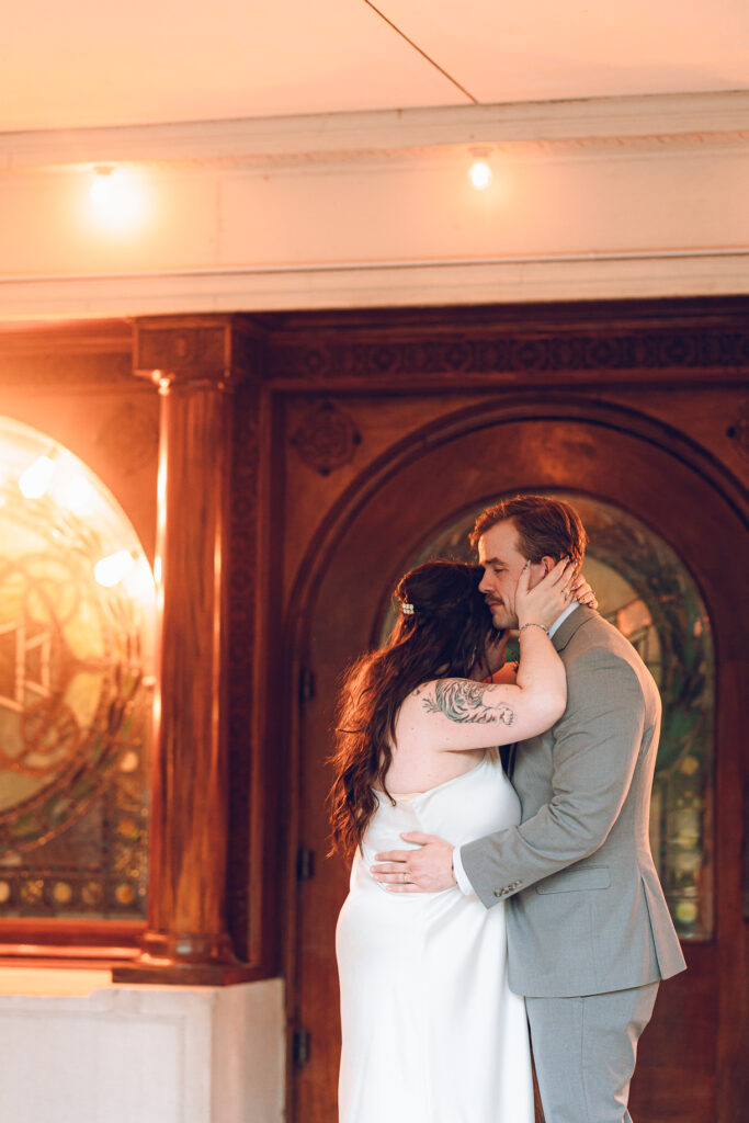 A couple gets celebrates their wedding at Pleasant House in Oak Park, Illinois.