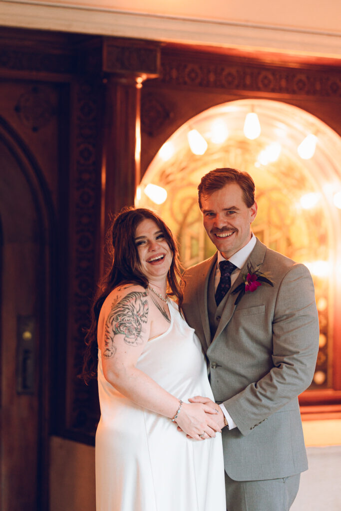 A couple gets celebrates their wedding at Pleasant House in Oak Park, Illinois.