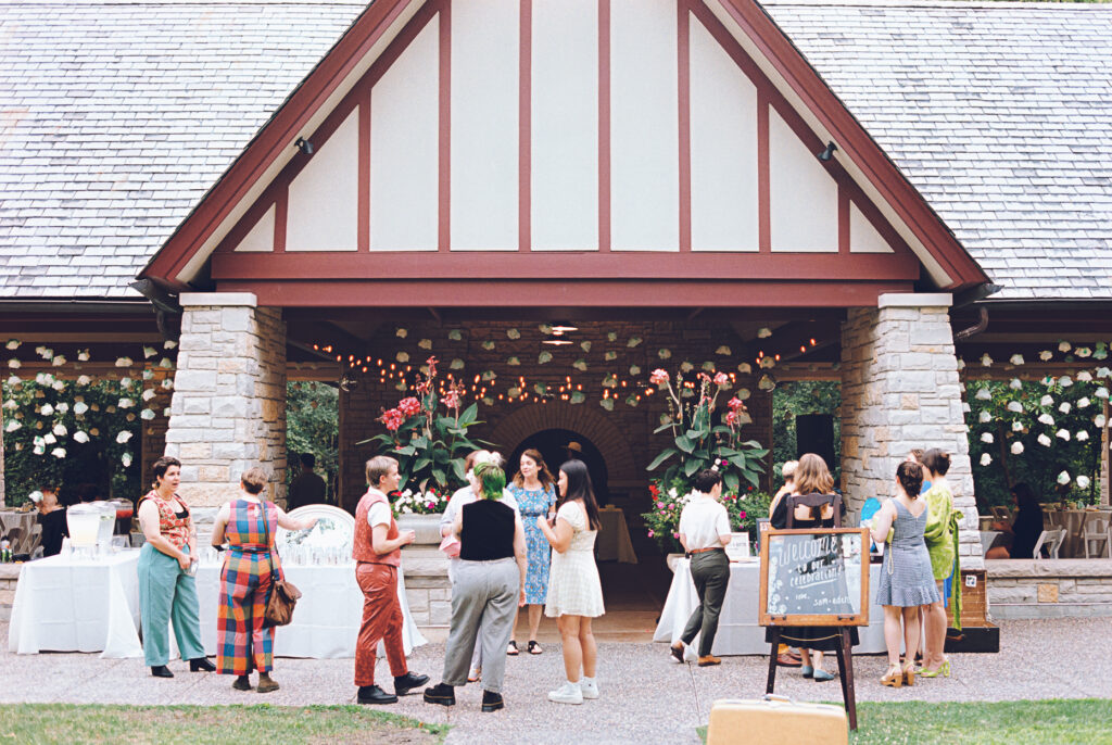 A queer couple celebrates their wedding at The Grove Redfield Estate in Glenview, Illinois.