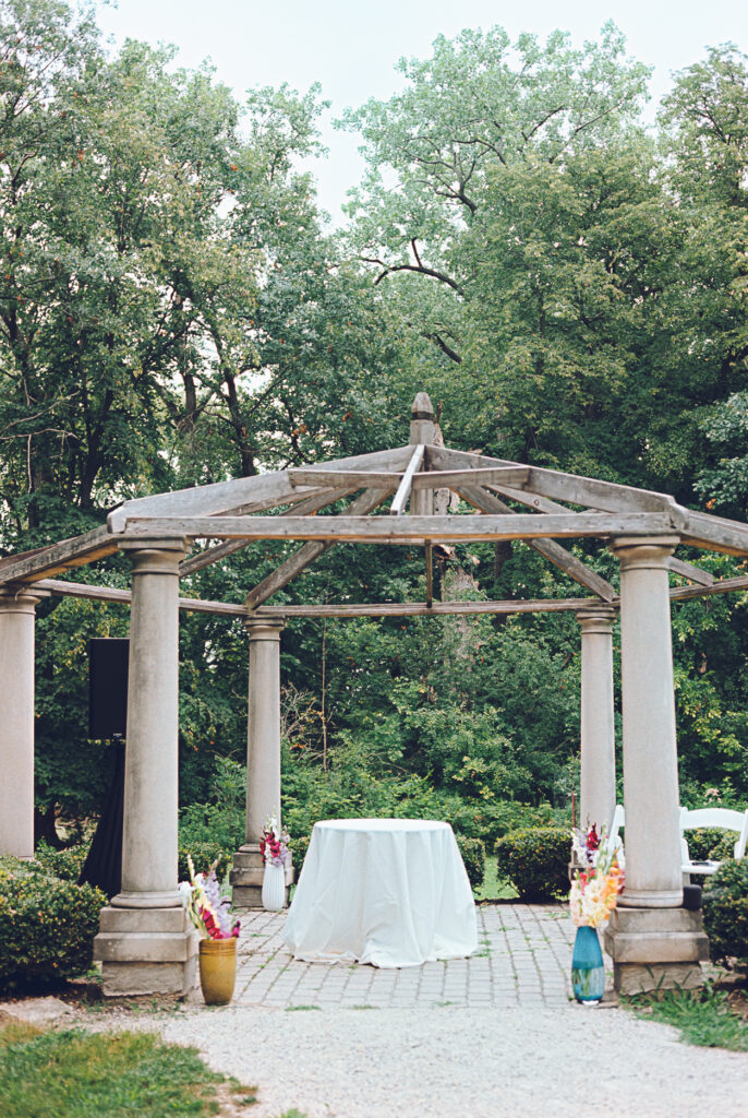 A queer couple celebrates their wedding at The Grove Redfield Estate in Glenview, Illinois.