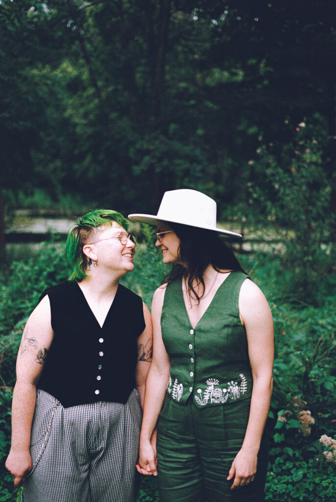 A queer couple celebrates their wedding at The Grove Redfield Estate in Glenview, Illinois.
