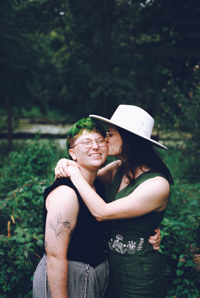 A queer couple celebrates their wedding at The Grove Redfield Estate in Glenview, Illinois.