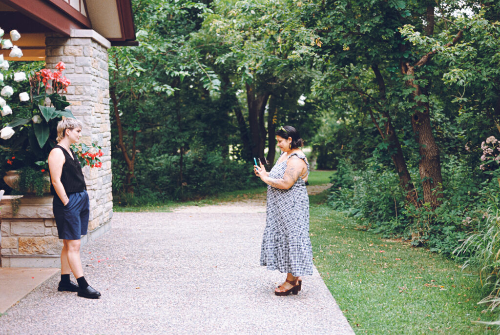 A queer couple celebrates their wedding at The Grove Redfield Estate in Glenview, Illinois.