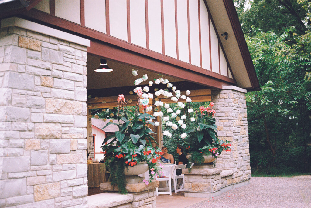 A queer couple celebrates their wedding at The Grove Redfield Estate in Glenview, Illinois.