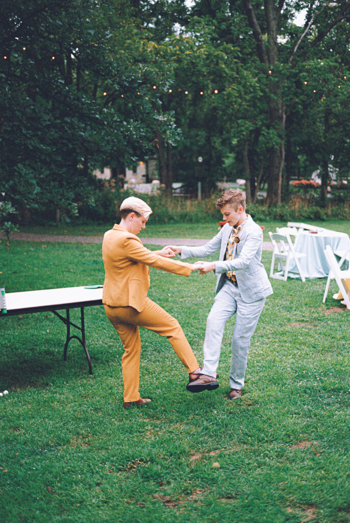 A queer couple celebrates their wedding at The Grove Redfield Estate in Glenview, Illinois.